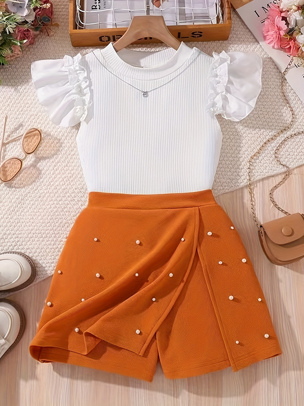 Completo elegante con top a maniche corte e gonna con perline