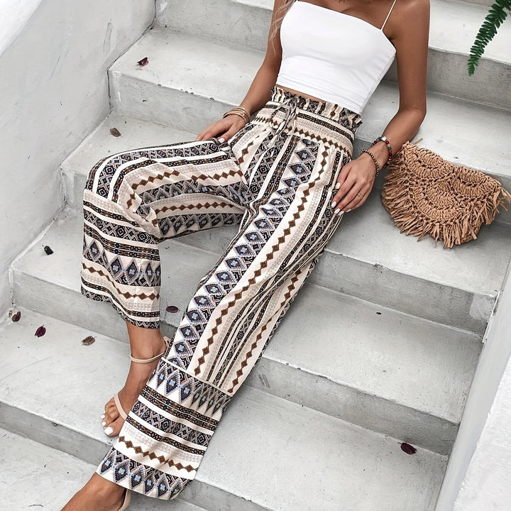 Pantaloni tropicali a vita alta e gamba larga